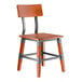 A wooden chair with a rustic mahogany finish, metal supports, and a solid backrest.