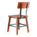 A wooden chair with a rustic mahogany finish and metal frame accents.