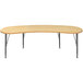 A Tot Mate maple curved rectangular table with legs.