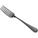 A close-up of a Bon Chef Como dinner fork with a matte black handle.