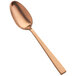 A Bon Chef stainless steel teaspoon with a matte rose gold finish.