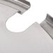A stainless steel inset with a hole in it.