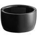 An Acopa glossy black stoneware ramekin.