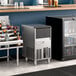 An undercounter gourmet cube ice machine with a stainless steel exterior, designed for commercial use.