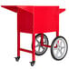 a red cart with wheels