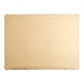 A close up of a gold laminated rectangular corrugated cake pad with scalloped edges.
