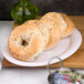 A bagel on a Carlisle bone melamine platter.