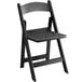 A black Lancaster Table & Seating folding chair with a slatted seat.