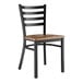 A Lancaster Table & Seating black finish ladder back chair with a vintage wood seat.