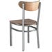 A Lancaster Table & Seating Boomerang chair with a wood seat and metal legs.