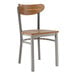 A Lancaster Table & Seating Boomerang chair with a wooden seat and back and metal frame.