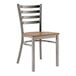 A Lancaster Table & Seating metal ladder back chair with a wood seat.