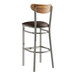 A Lancaster Table & Seating bar stool with a brown leather seat.