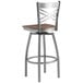 A Lancaster Table & Seating bar stool with a wooden seat and metal frame.