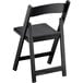 A black Lancaster Table & Seating folding chair with a black seat.