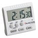 A white digital kitchen timer with a clock.