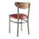A Lancaster Table & Seating Boomerang clear coat finish chair with a burgundy vinyl cushion and vintage wood back.