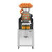A commercial automatic feed juicer with a tank podium designed for high-capacity orange juicing.
