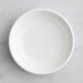 A white Tablecraft mini melamine plate.