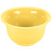 A close-up of a yellow Fiesta china bouillon bowl.