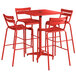 A red Lancaster Table & Seating bar table with barstools.