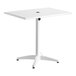 A white Lancaster Table & Seating outdoor table with a white metal base.