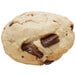 A Rich's chocolate chunk scone with a bite taken out of it.