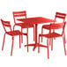 A red Lancaster Table & Seating outdoor table with chairs.