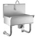 A Regency stainless steel hand sink with a knee operated faucet.