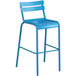 A blue bar stool with a white backrest.