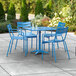 A blue table and chairs on a patio.