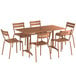 A Lancaster Table & Seating brown aluminum table with an umbrella hole and 6 chairs on an outdoor patio.