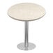 A round table with a nebula gray quartz surface.