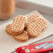 A close-up of a Nabisco Nutter Butter cookie.