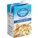 A blue and white College Inn carton of chicken broth.