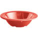 An orange Acopa Foundations narrow rim melamine fruit bowl.