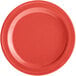 An orange melamine plate with a narrow rim.