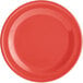 An orange melamine plate with a narrow white rim.