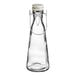 A clear glass carafe with a white resealable lid.