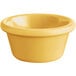 An Acopa Foundations yellow smooth melamine ramekin.