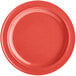 An orange melamine plate with a narrow rim.