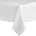 A white rectangular tablecloth with a folded edge on a table.