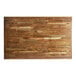 A Lancaster Table & Seating bar height wooden table with a vintage butcher block top.