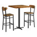A Lancaster Table & Seating butcher block table with two chairs and a stool.