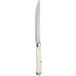 A Walco stainless steel steak knife with a white Delrin handle.