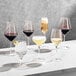 A group of Della Luce Astro coupe glasses on a table.