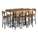 A Lancaster Table & Seating butcher block table with 8 bar height chairs.