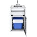 A stainless steel Crown Verity small built-in cabinet with a sink and blue garbage holder.