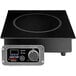 A close-up of a black and silver Spring USA induction range with a digital display.