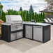 A Crown Verity built-in vertical access door on a counter in an outdoor kitchen.